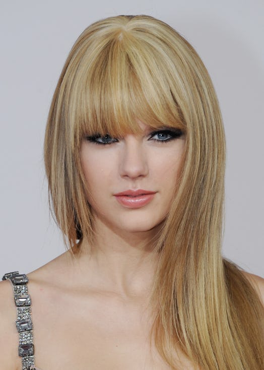 Taylor Swift's long, blunt bangs at the 2010 American Music Awards, paired with long, pin-straight s...