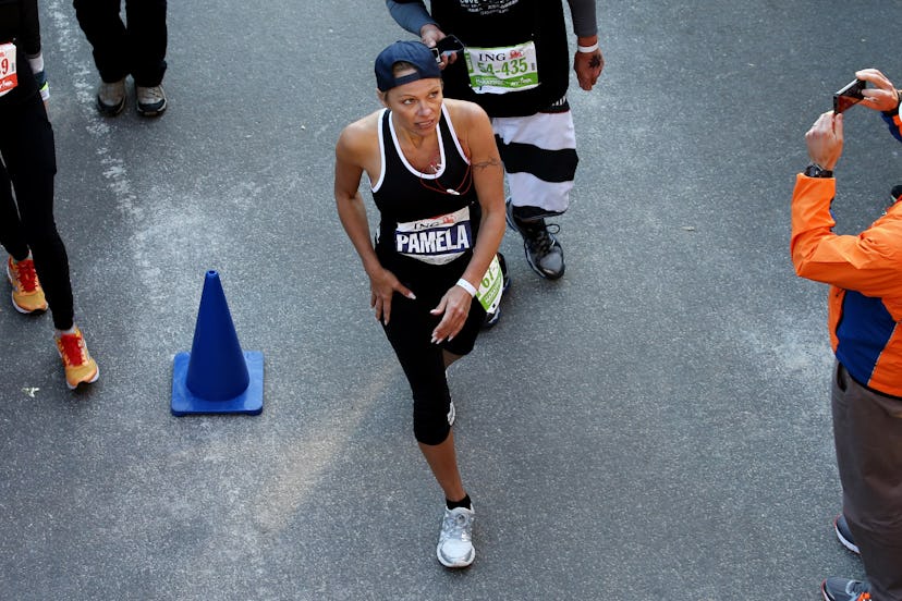 Pamela Anderson crosses the finish line in Central Park during the 2013 marathon.