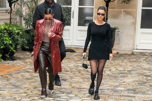 PARIS, FRANCE - MARCH 02: Kim Kardashian West and her sister Kourtney Kardashian leave a pop-up fash...