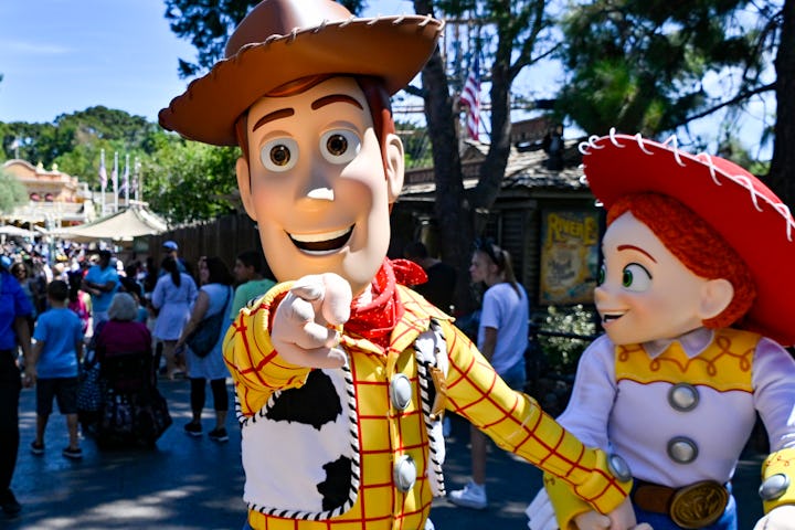 Anaheim, CA - August 10: Woody and Jessie, from Pixars Toy Story, walk through Frontierland at Disne...