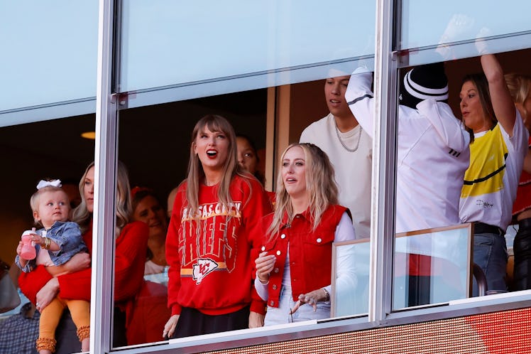 Taylor Swift and Brittany Mahomes react to a touchdown scored by Travis Kelce.
