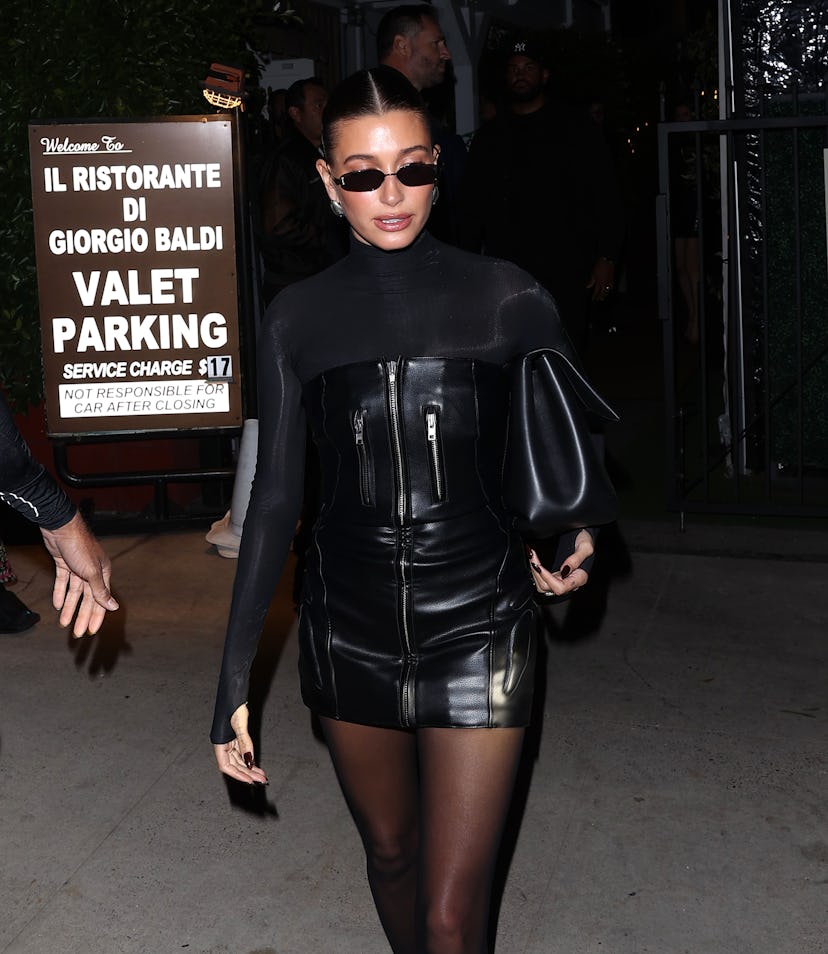 Hailey Bieber wears a strapless leather mini dress from kylie jenner's brand khy