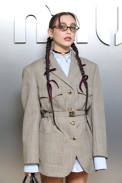 Emma Chamberlain pigtail braids and velvet bows at Miu Miu Paris Fashion Week ss24
