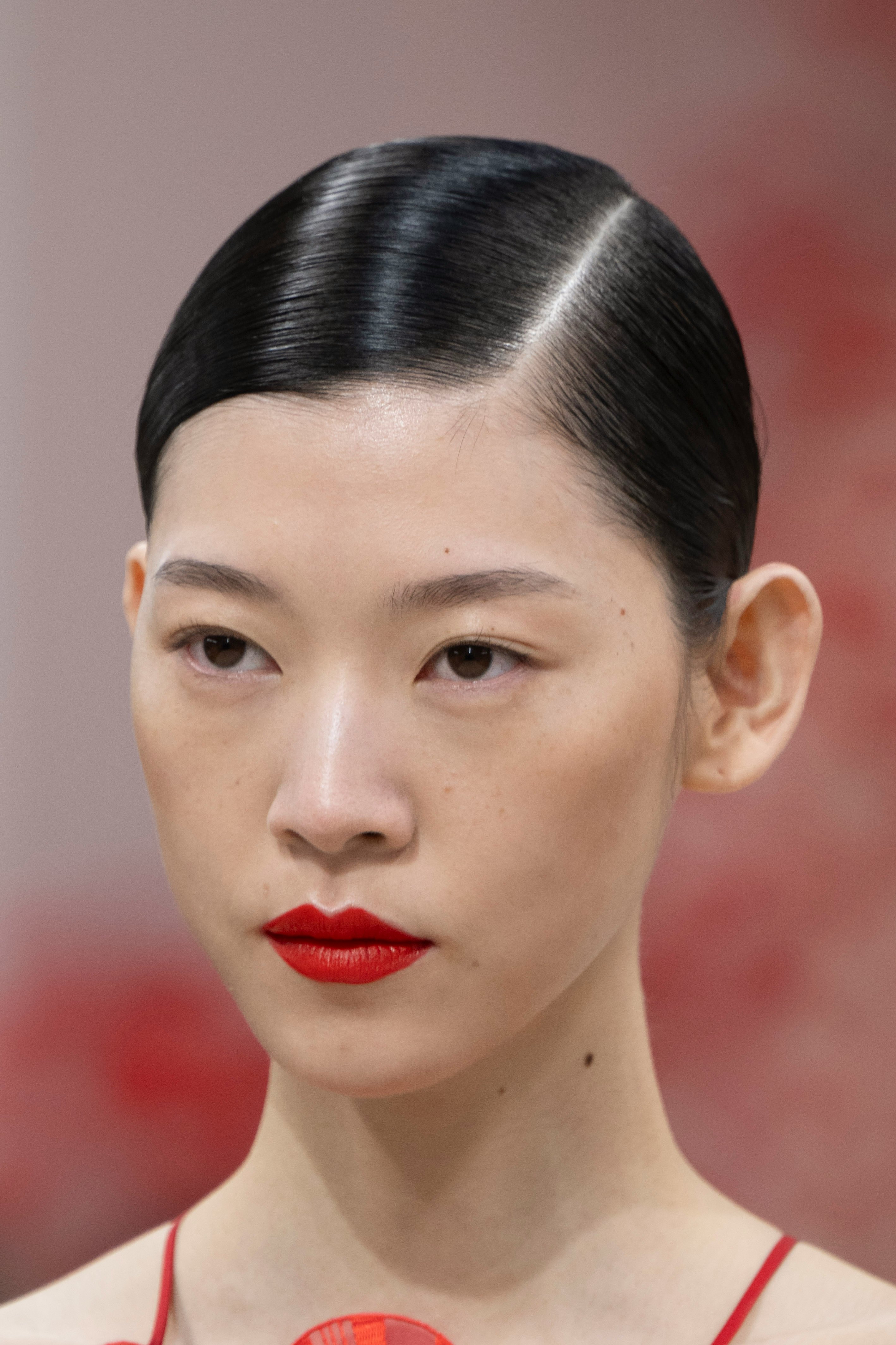 Sleek headbands, glossy waves, dark lips and more beauty trends from the  Spring 2024 Fashion Week runways