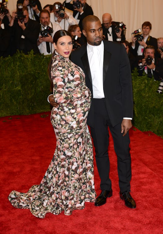 Kanye West and Kim Kardashian attend the "PUNK: Chaos to Couture" met gala in 2013