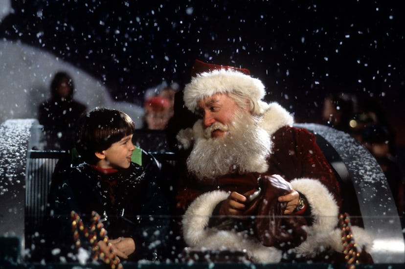 Tim Allen on a sled talking with a child in a scene from the film 'The Santa Clause', 1994. (Photo b...