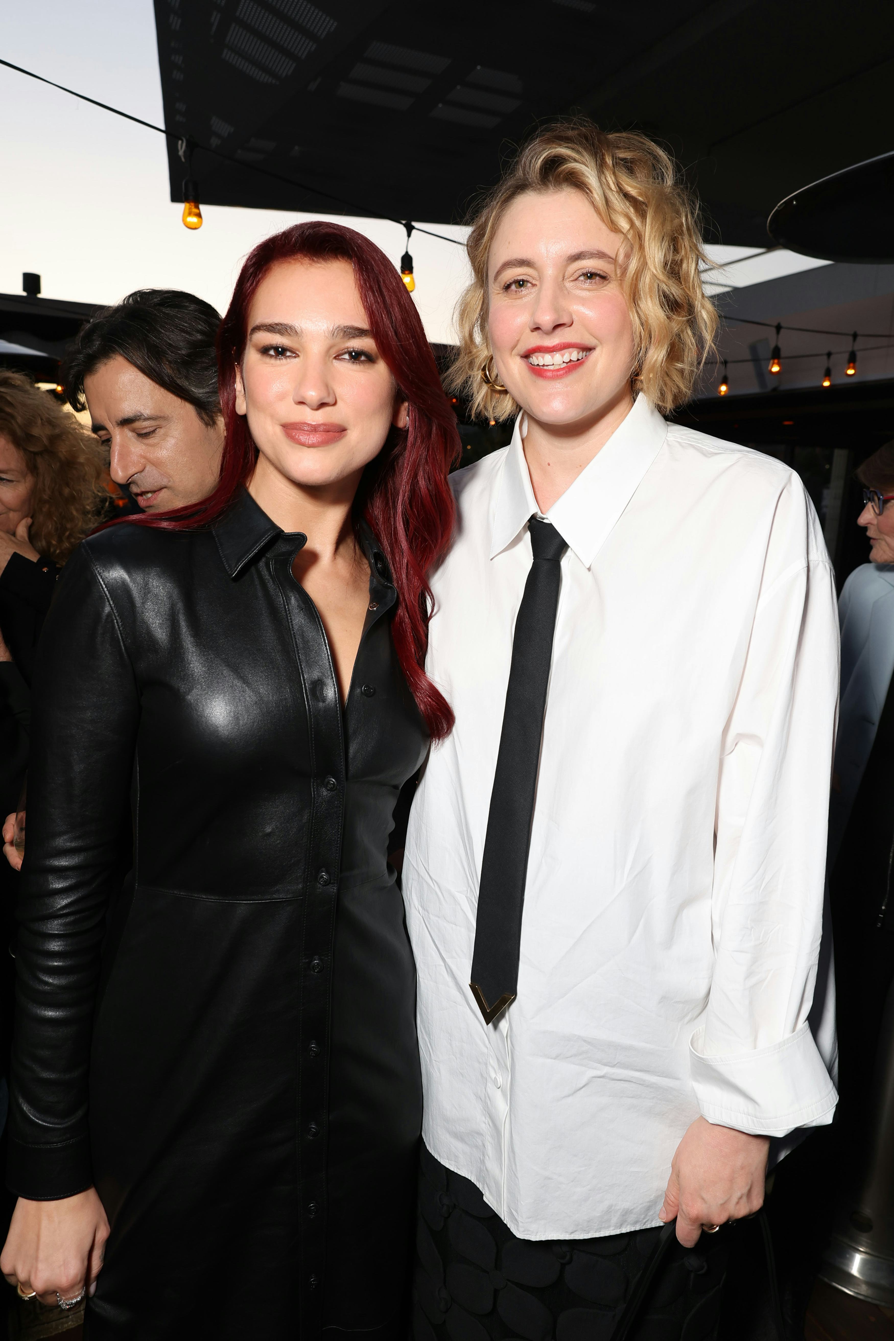 Dua Lipa&rsquo;s dark red cherry coke hair and Greta Gerwig on October 27, 2023.