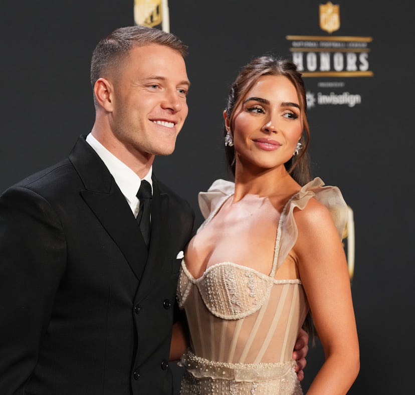 PHOENIX, AZ - FEBRUARY 09: Christian McCaffrey and Olivia Culpo pose for a photo on the red carpet d...