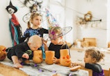 Big family with four children. Halloween celebration. Traditional american culture. Kids handicrafti...