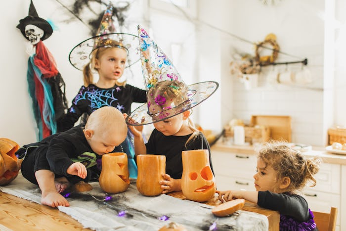 Big family with four children. Halloween celebration. Traditional american culture. Kids handicrafti...