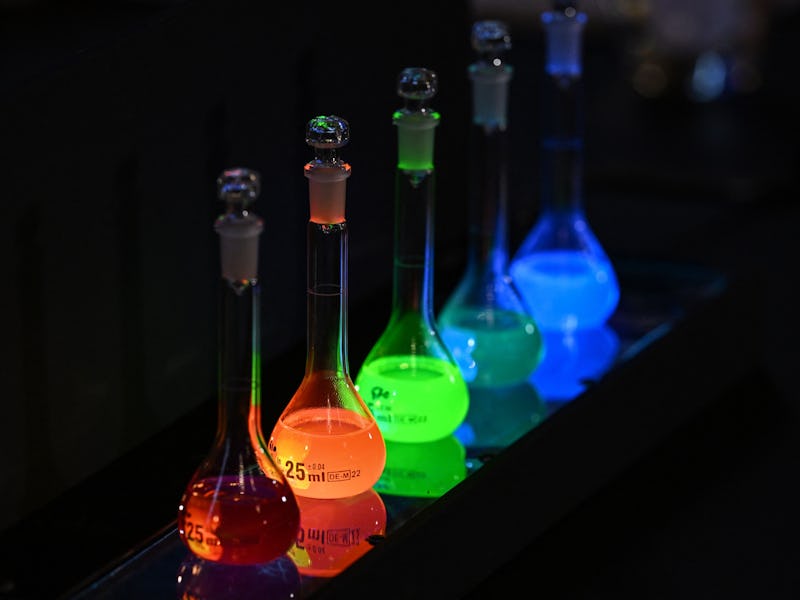 Laboratory flasks are used for explanation during the announcement of the winners of the 2023 Nobel ...
