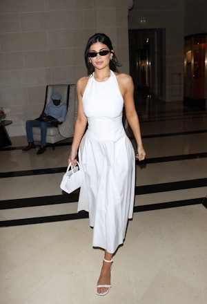 Kylie Jenner Slips On Thong Boots at Paris Fashion Week – Footwear