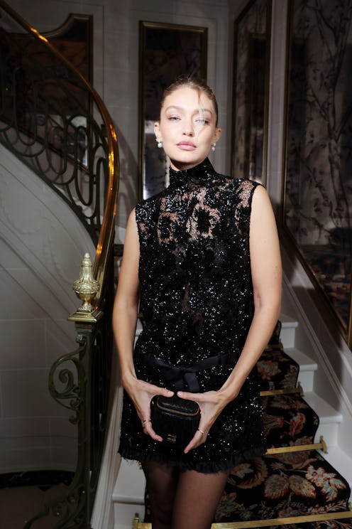 Gigi Hadid’s French roll hairstyle at a Miu Miu party during Paris Fashion Week S/S 2024 on October …