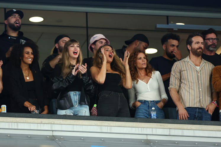 Taylor Swift and Blake Lively cheer from the stands during an NFL football game between the New York...