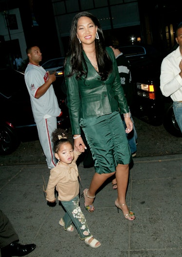Kimora Lee Simmons with daughter Ming-Lee at the Baby Phat Spring 2003 fashion show during Mercedes-...