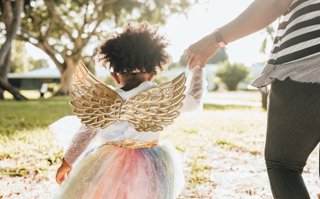 Woman with toddler in costume
