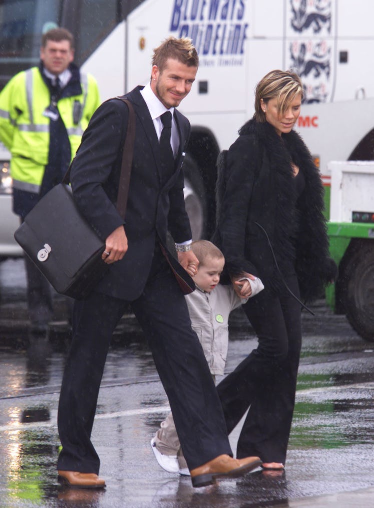 David and Victoria Beckham walk with their son Brooklyn at Luton Airport, towards that the British A...