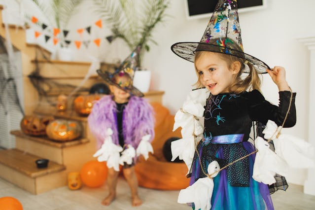 Two children dressed as witches for Halloween. Two sets of data shed light on the most popular Hallo...