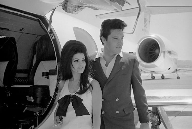 Newlyweds Elvis and Priscilla Presley, who met while Elvis was in the Army, prepare to board their p...