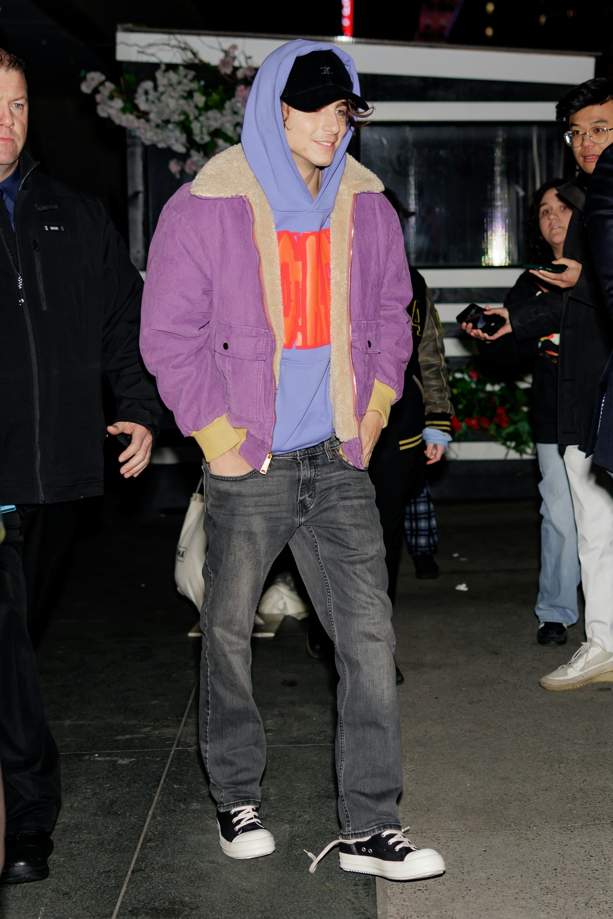 Timothée Chalamet wears a hoodie, jacket, and jeans in New York.