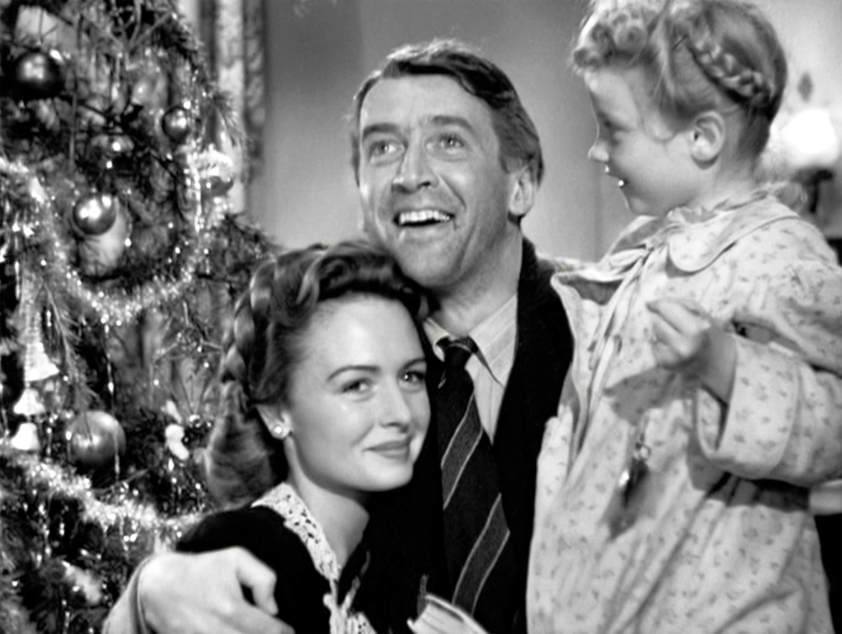 Donna Reed, James Stewart, and Karolyn Grimes in &lsquo;It&rsquo;s a Wonderful Life.&rsquo; Photo via Getty Images