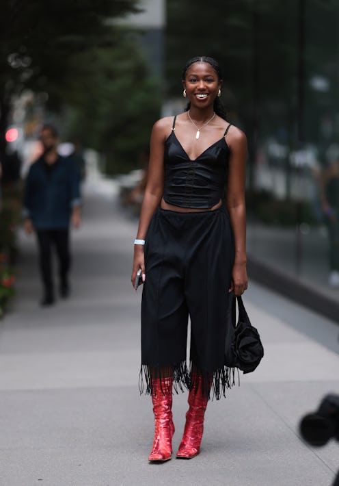 NEW YORK, NEW YORK - SEPTEMBER 09: Guest is seen outside Proenza Schouler show wearing golden drop s...