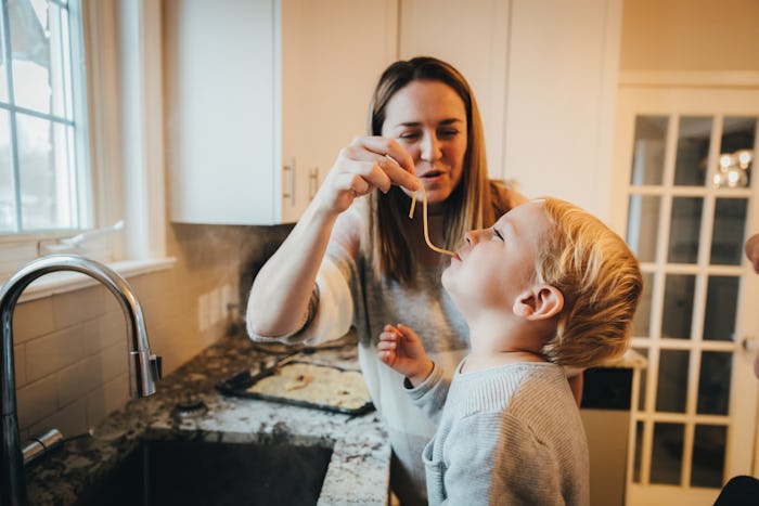 Children, Kitchen, Baby Boy - Mother and son preparing pasta together in the kitchen