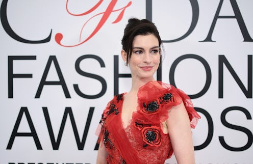 Anne Hathaway wore a red Rodarte dress that included an exposed thong moment