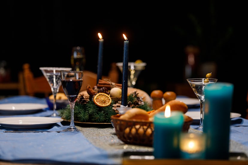 Use taper and votive candles to set the mood at your holiday dinner party. 