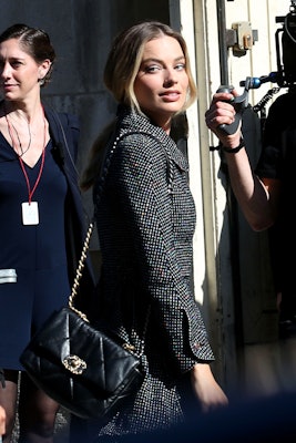 Margot Robbie wears a suit and the Chanel 19 bag in Paris.