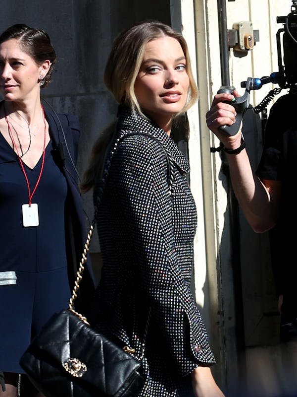 Margot Robbie wears a suit and the Chanel 19 bag in Paris.