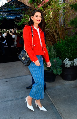 Katie Holmes wears a red jacket, jeans, and the Chanel 19 bag in New York.