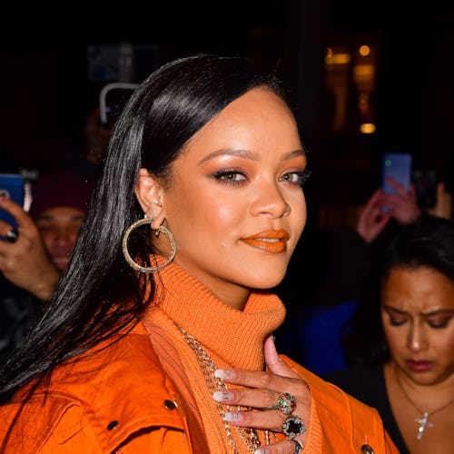 Rihanna orange outfit and french tip nails
