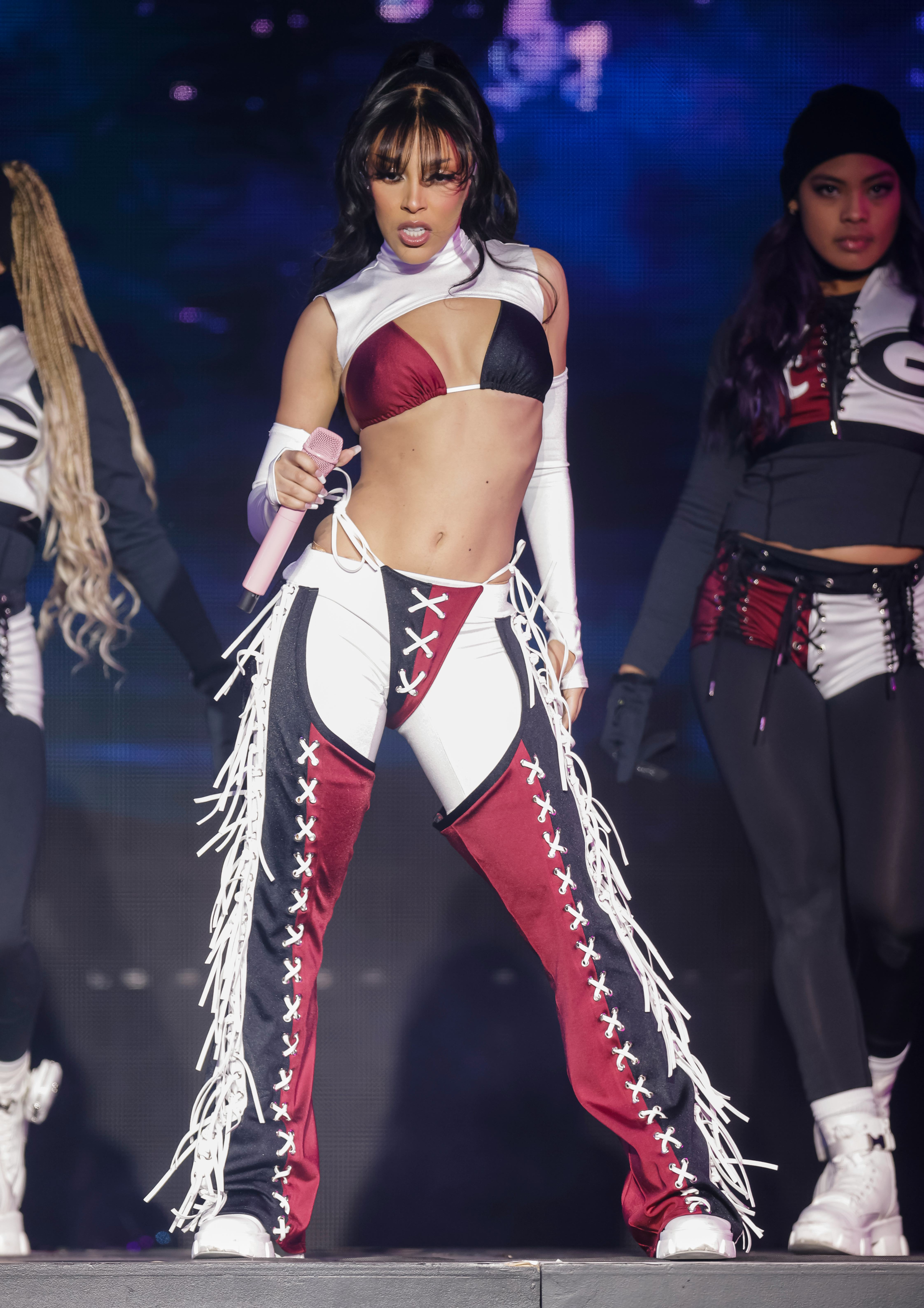 Doja Cat performs during the 2022 College Football Playoff Concert Series with a whale tail.