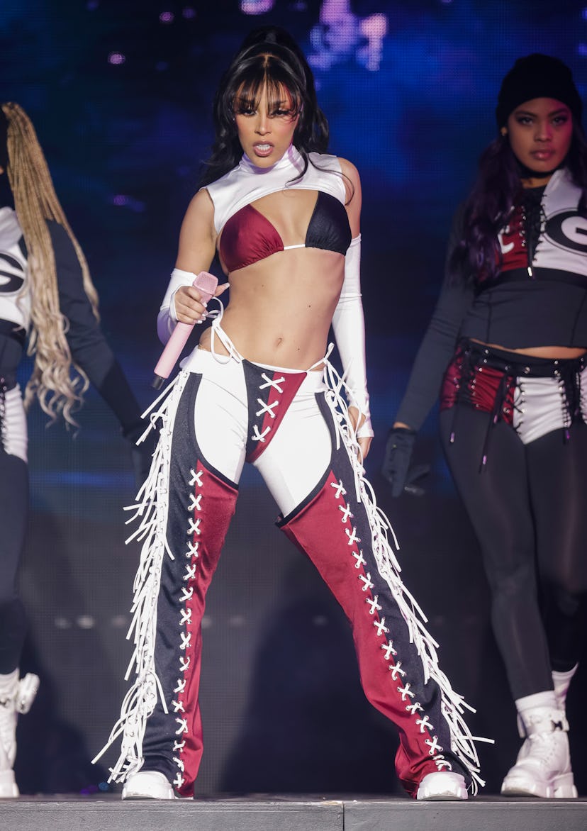 Doja Cat performs during the 2022 College Football Playoff Concert Series with a whale tail.