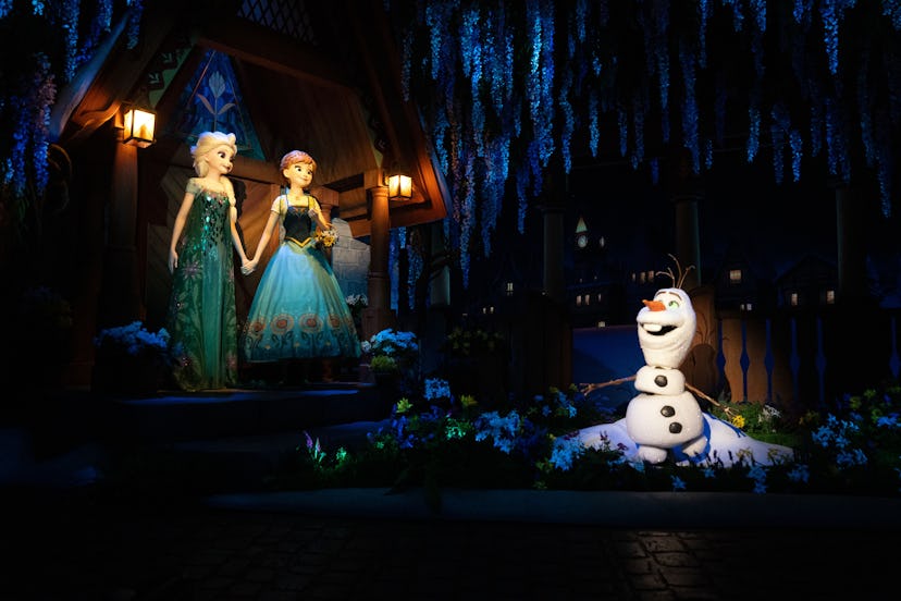 Figurines of Elsa, Anna and Olaf at the Frozen Ever After boat ride in the World of Frozen themed ar...