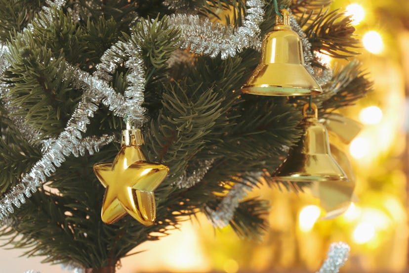 closeup of star ornament in christmas tree in roundup of christmas captions religious