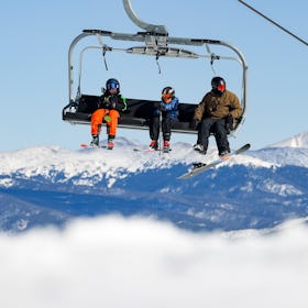 BRECKENRIDGE, CO - NOVEMBER 13: People ride up the mountain on a chair lift on opening day at Brecke...