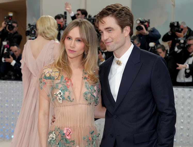 Suki Waterhouse and Robert Pattinson attend the 2023 Met Gala Celebrating "Karl Lagerfeld: A Line Of...