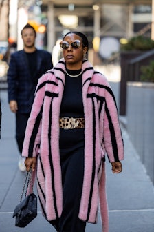 NEW YORK, NEW YORK - FEBRUARY 14: Nicole Martine Chapoteau wears pink black striped coat, animal pri...