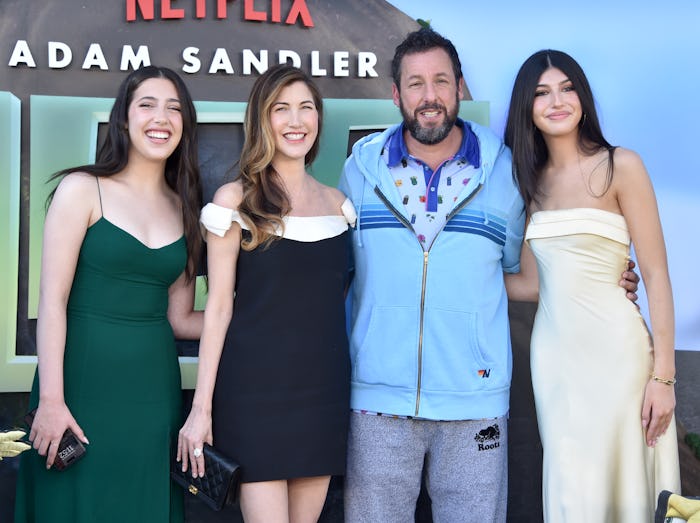 Adam Sandler's daughters are in their own world in his van.