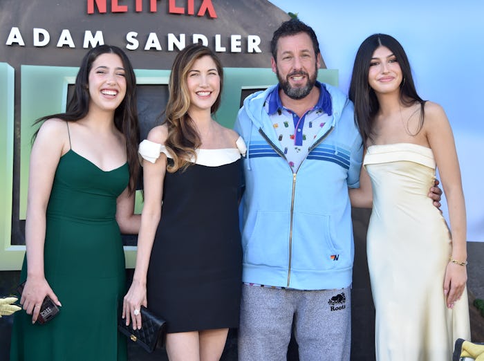 Adam Sandler's daughters are in their own world in his van.