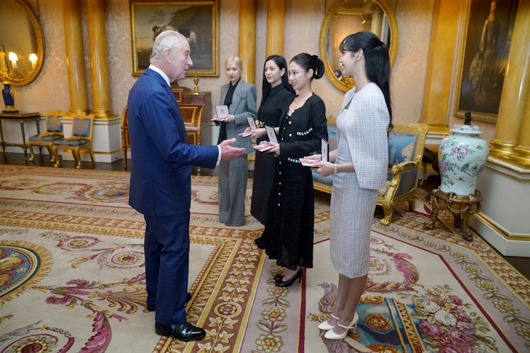 King Charles III presents the members of the K-Pop band Blackpink, (left to right) Rose (Roseanne Pa...