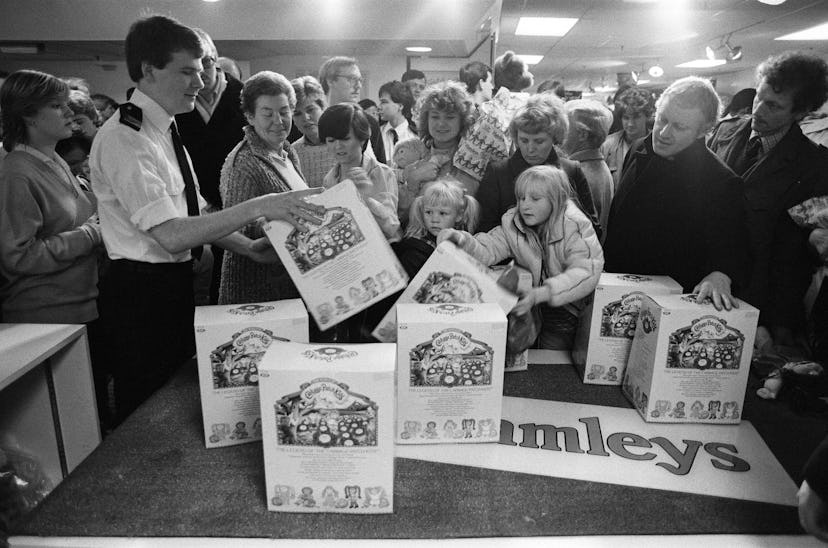 Shoppers buying Cabbage Patch Dolls at Hamleys, London toy store, 3rd December 1983. (Photo by Staff...