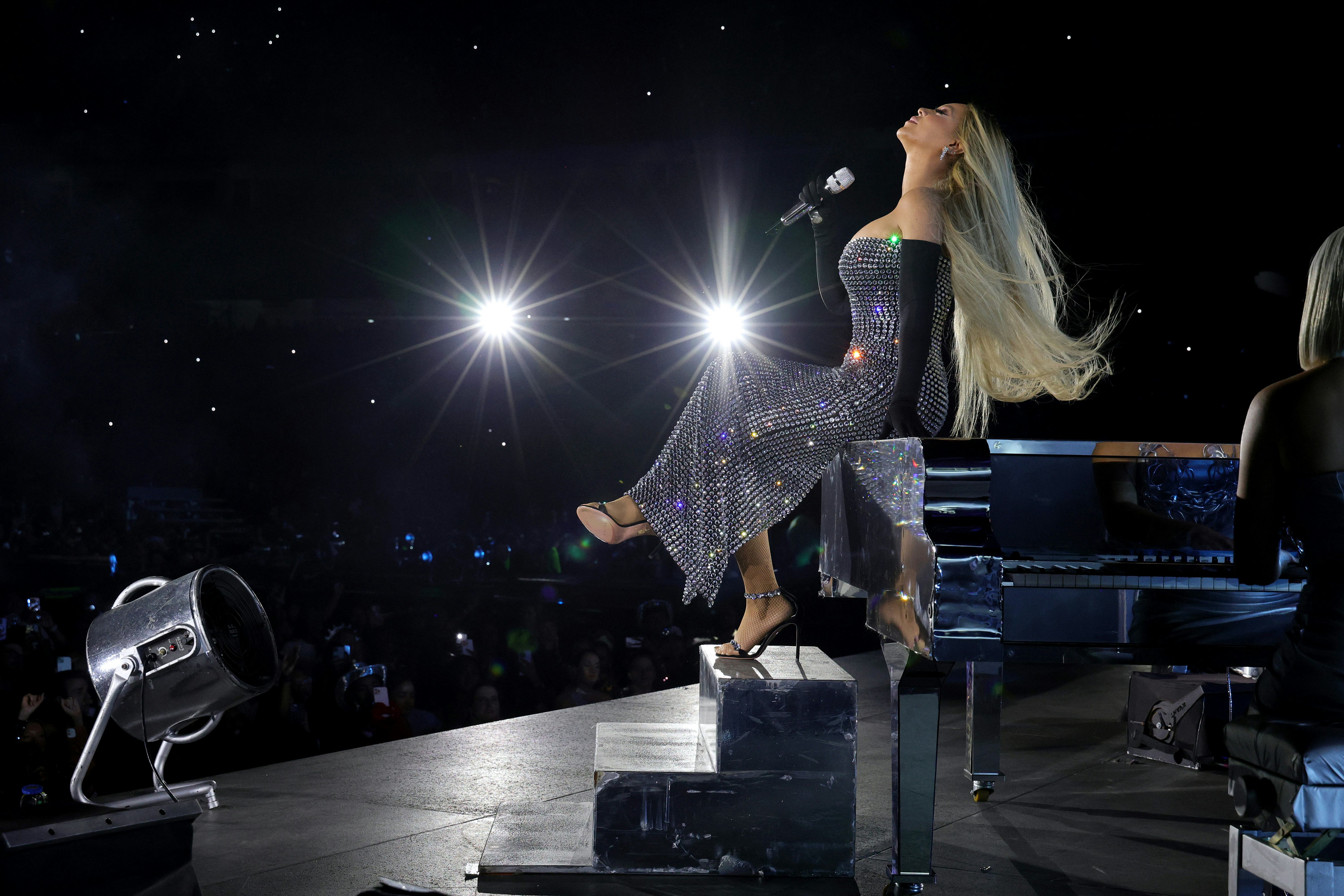 Beyoncé performs at a piano on the Renaissance Tour.