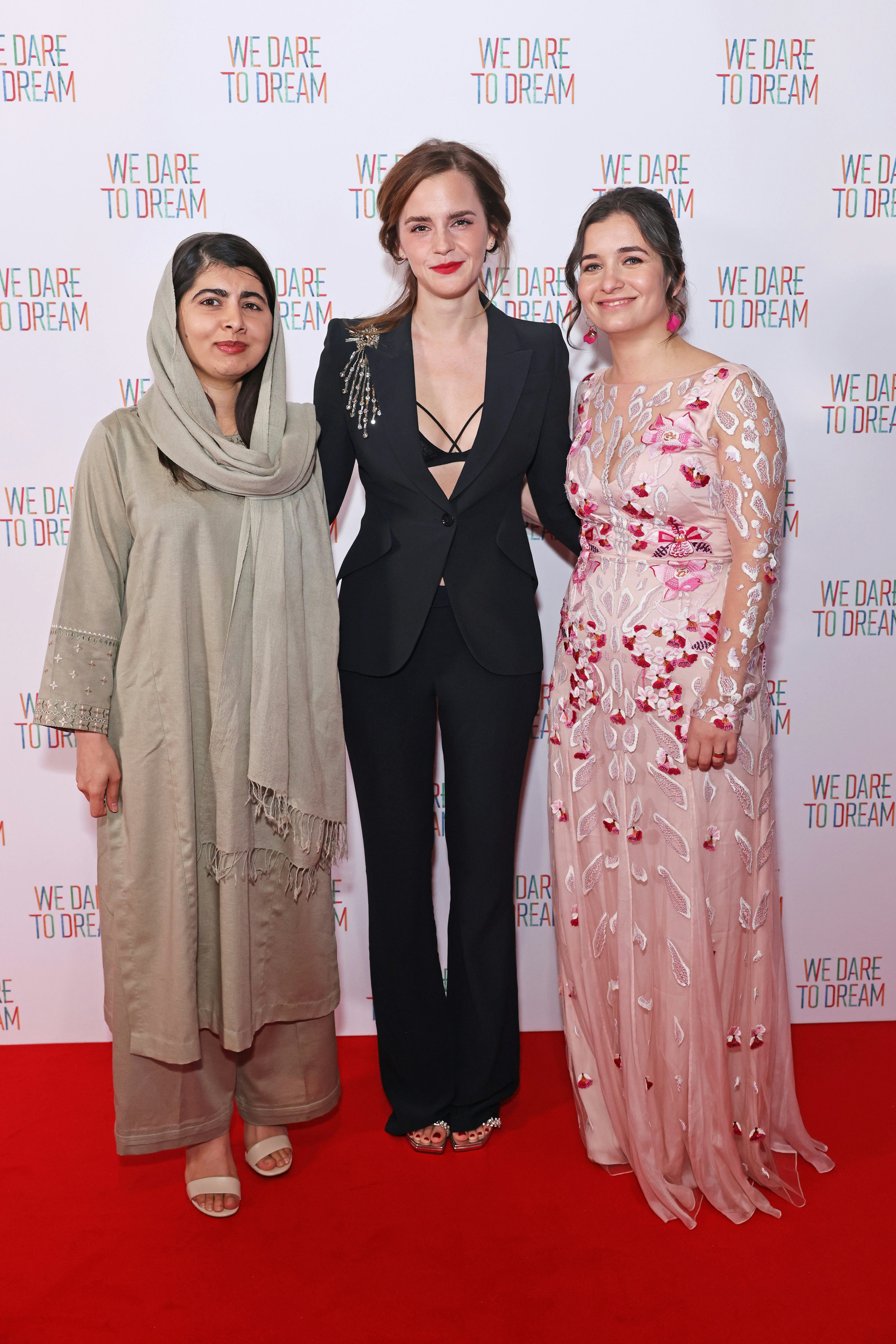 Emma Watson wore a criss-cross bralette under her Alexander McQueen blazer