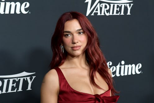 Dua Lipa wears a red dress to the 2023 Variety Power Of Women. 