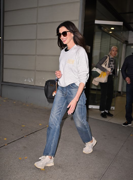 Anne Hathaway leaves "The Drew Barrymore Show" at CBS Broadcast Center on November 27, 2023 in New Y...
