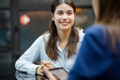 Determine Earning Power and Professional Growth Opportunities.  A new female employee on a job inter...