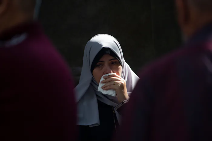 GAZA CITY, GAZA - OCTOBER 11: A woman cries during a funeral procession at Al-Shifa Hospital on Octo...